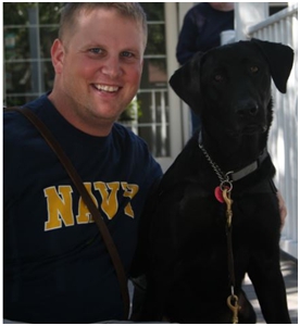 Ryan with his service dog, Spirit. 